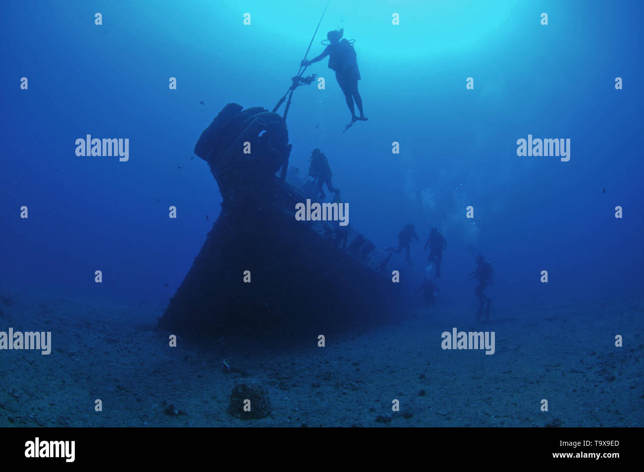 Divers explore the Mahi shipwreck at the west coast of Oahu, Hawaii