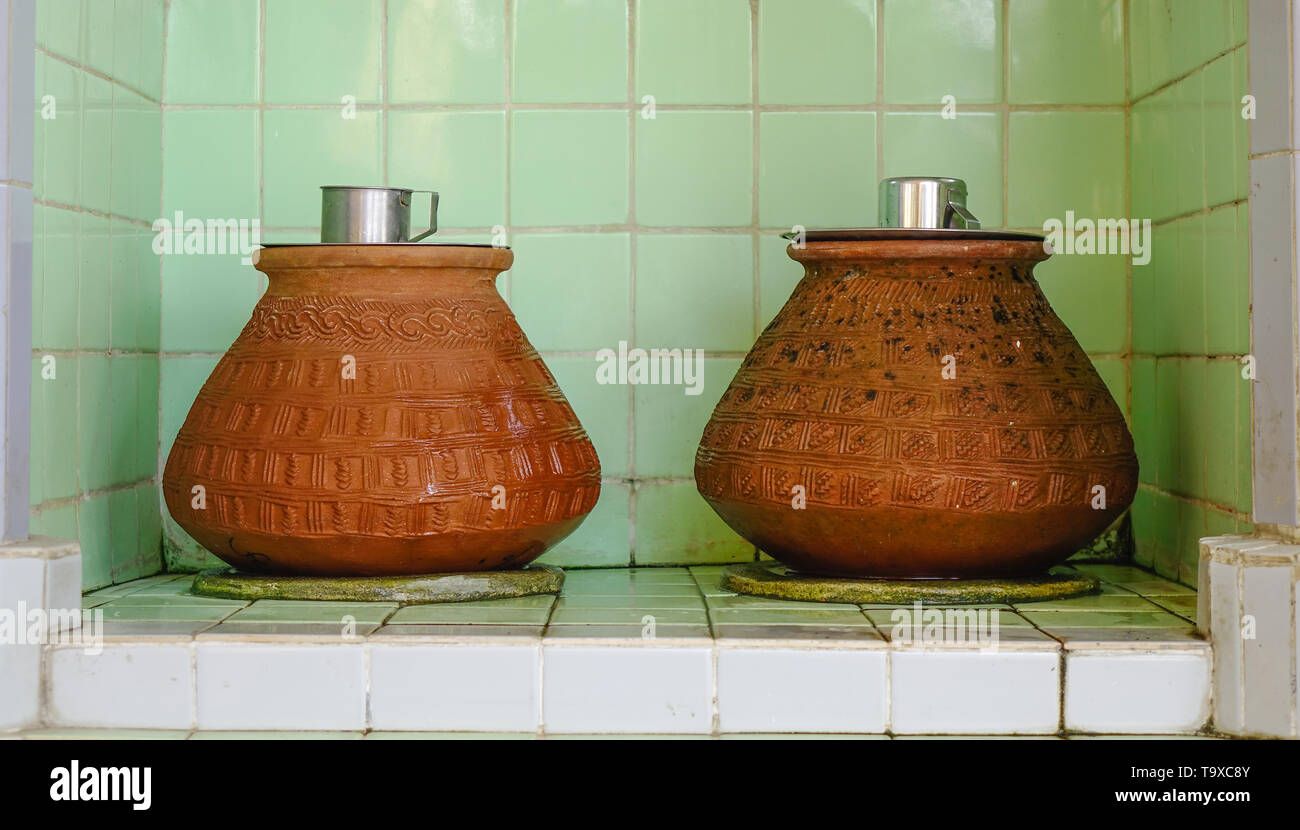 Clay pots with water for drinking at a temple in Yangon, Myanmar Stock