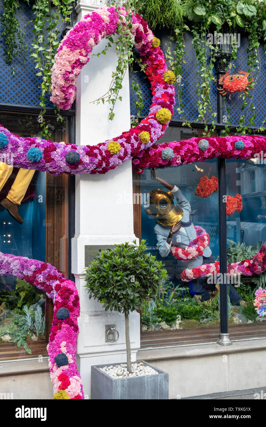 Floral display outside Hackett shop in Sloane Street for Chelsea in