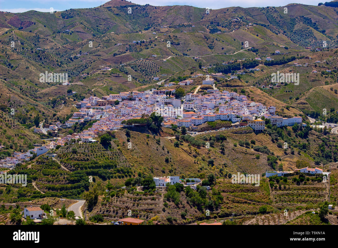 The town of Almáchar, in the province of Málaga, part of Andalusia in southern Spain shot from the mountains above, showing the traditional white wash Stock Photo