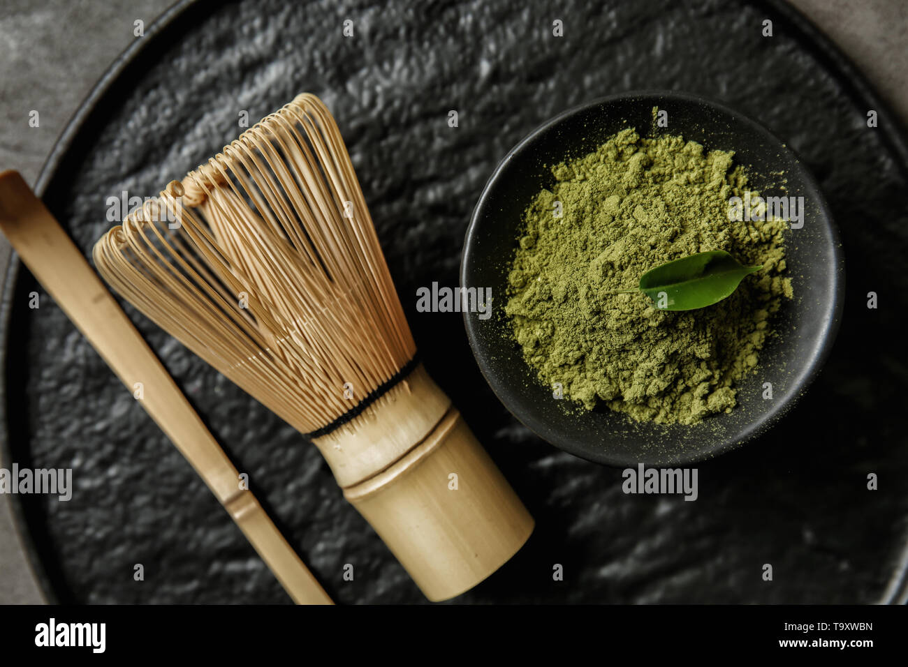 Composition with powdered matcha tea on tray Stock Photo