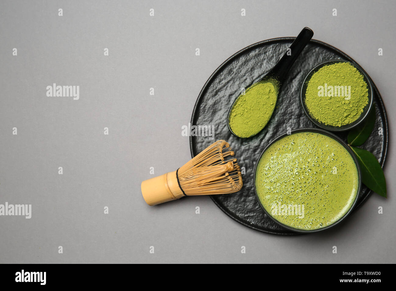 Composition with matcha tea on grey background Stock Photo