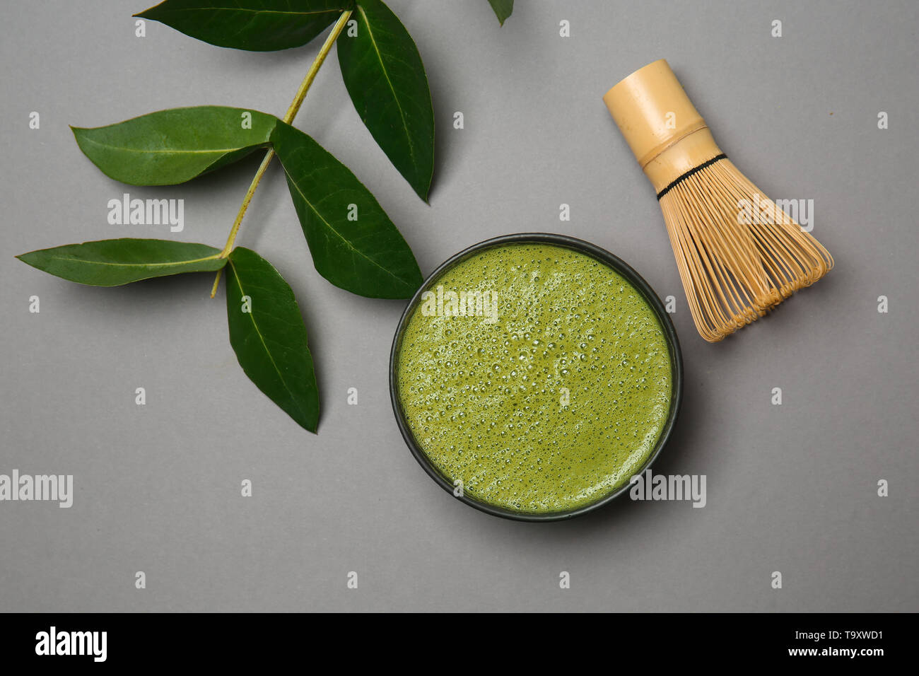Composition with matcha tea on grey background Stock Photo