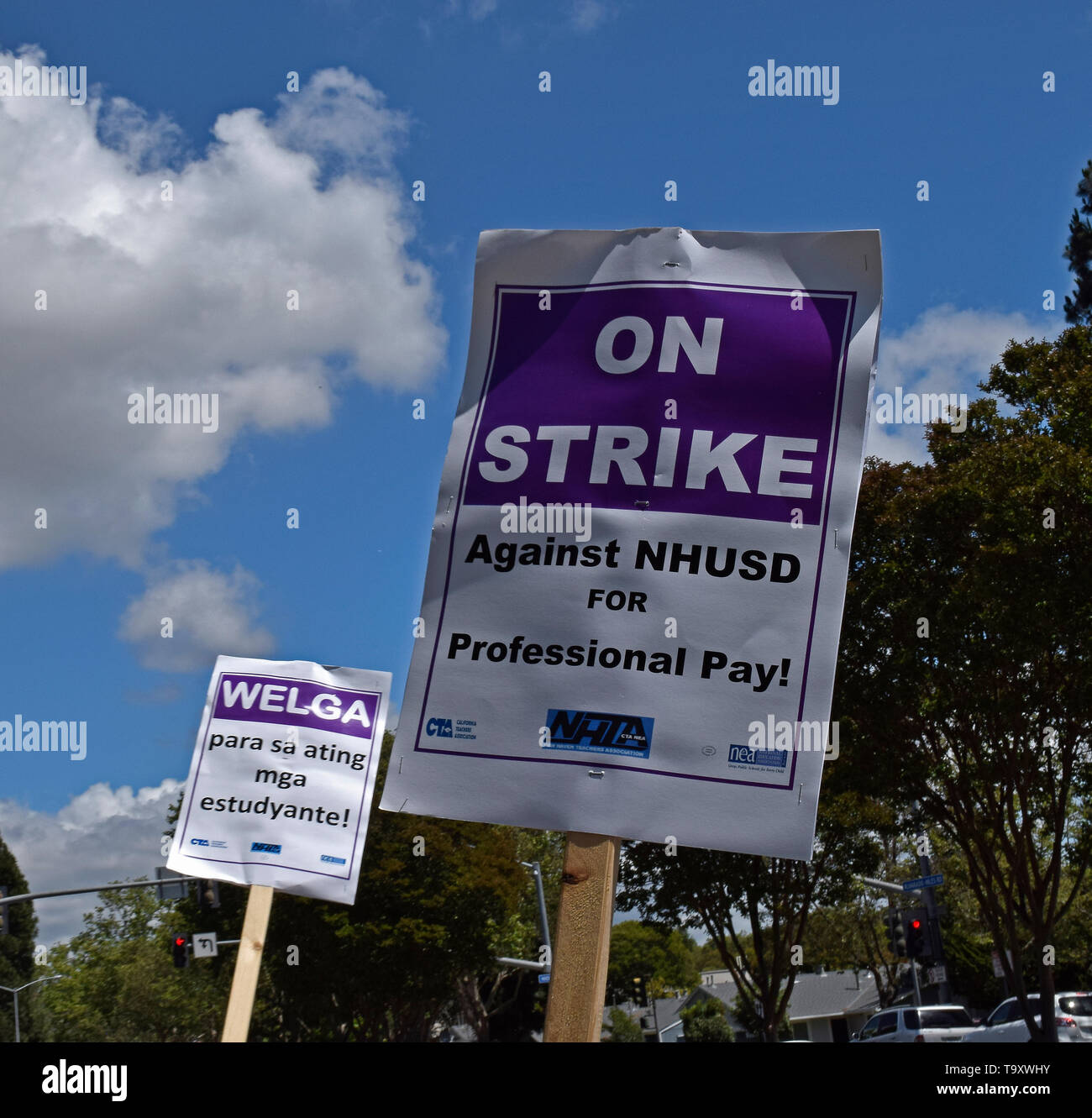 on strike picket signs in multiple languages, for professional pay, by New Haven Teachers Association against the New Haven Unified School District in Union City, California, on May 20, 2019 Stock Photo