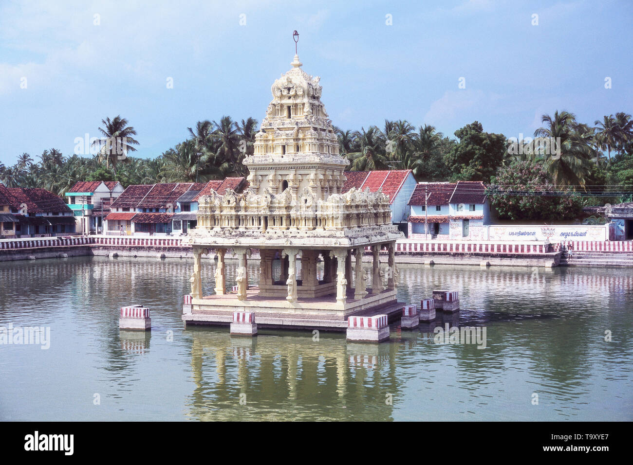 VIEW OF SUCHINDRAN TEMPLE WITH THE MOAT WITH WATER, KERALA Stock Photo