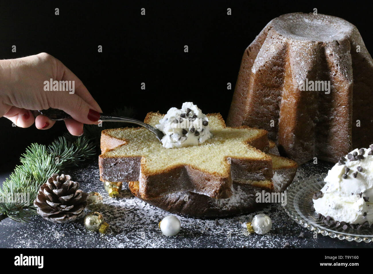 The traditional Italian Christmas cakes.Slice of Pandoro traditional  italian Christmas cake with cream and chocolate granules on dark background  Stock Photo - Alamy
