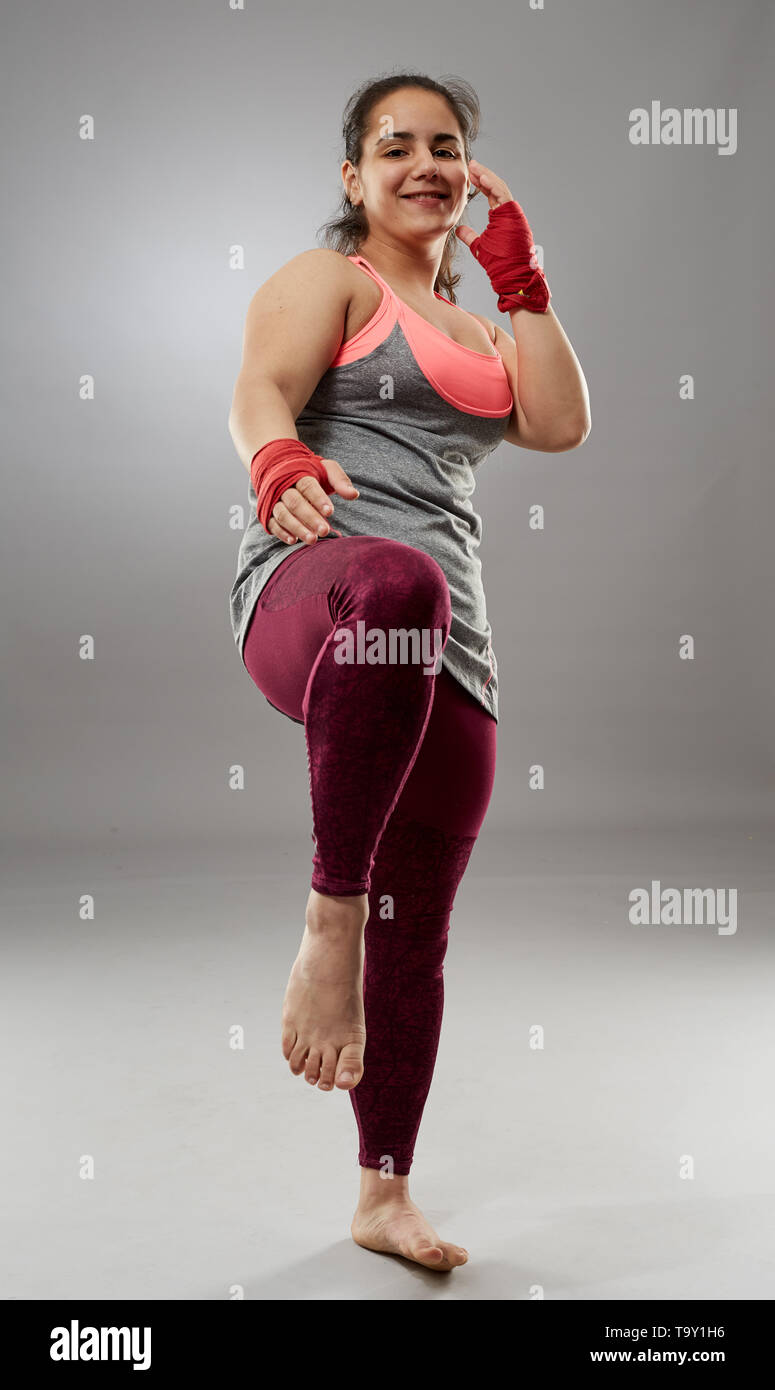 Young kickboxing female fighter in hand wraps, barefoot Stock Photo Alamy