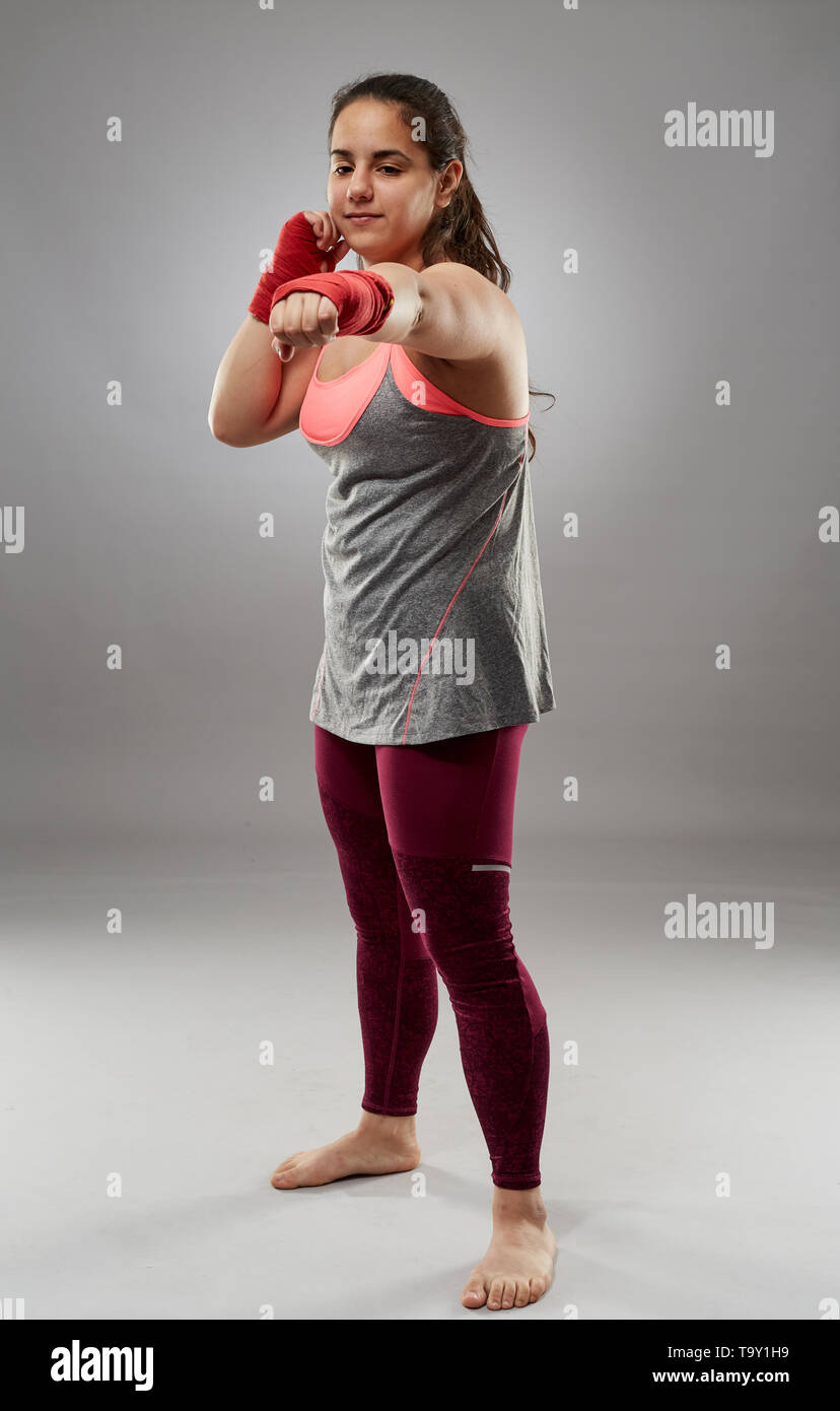 Young kickboxing female fighter in hand wraps, barefoot Stock Photo Alamy