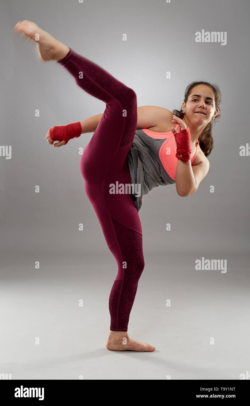 Young kickboxing female fighter in hand wraps, barefoot Stock Photo Alamy