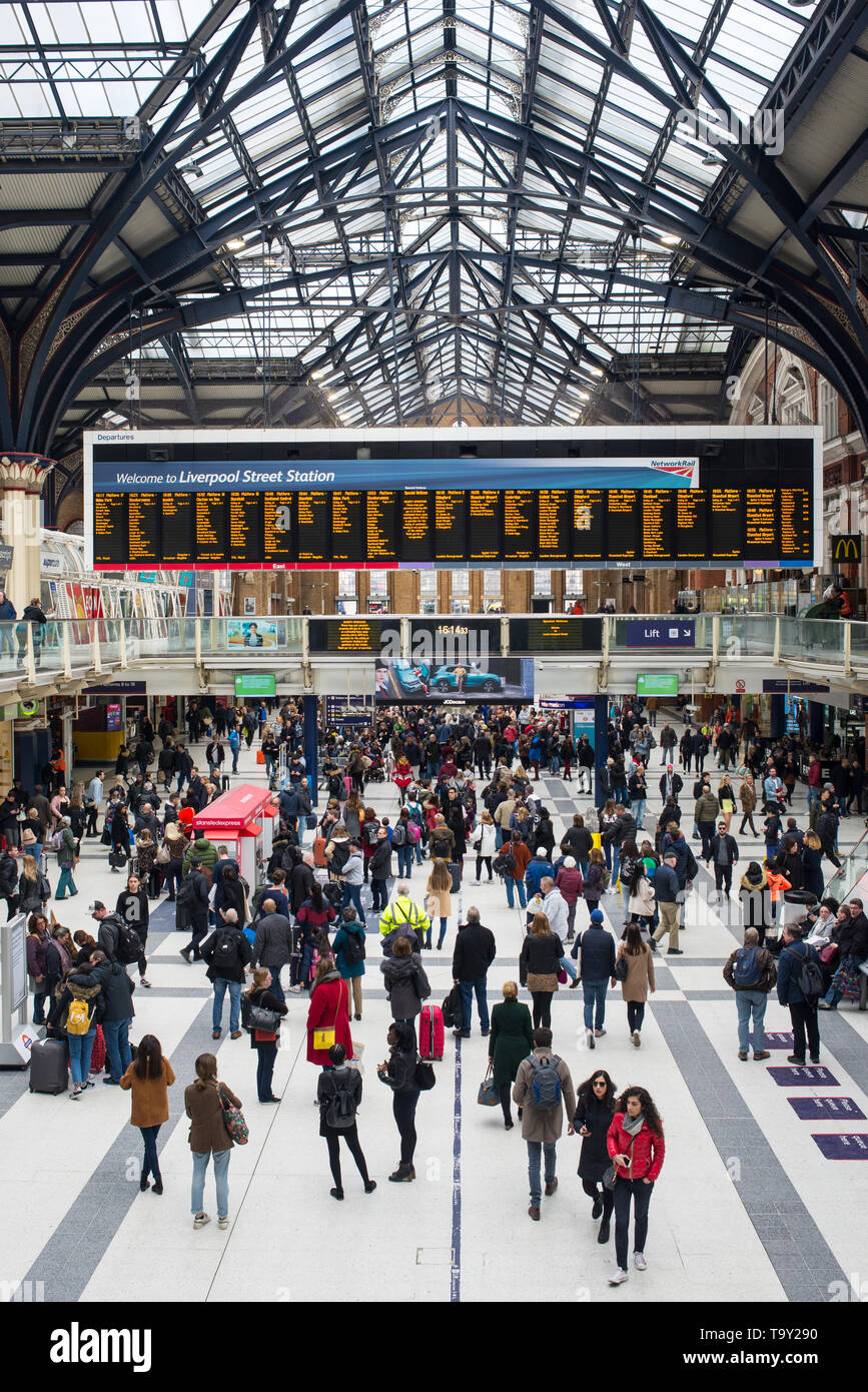 Liverpool Street Station, London, England, UK - April 2019: People tourists and commuters in the hall of the busy London Liverpool Street Station Stock Photo
