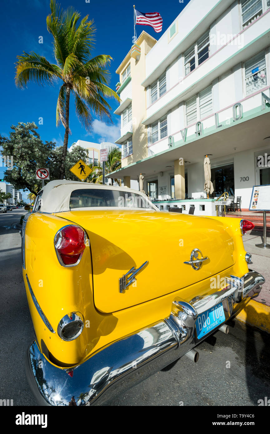 Vintage classic car parked in front of the hotel hires stock