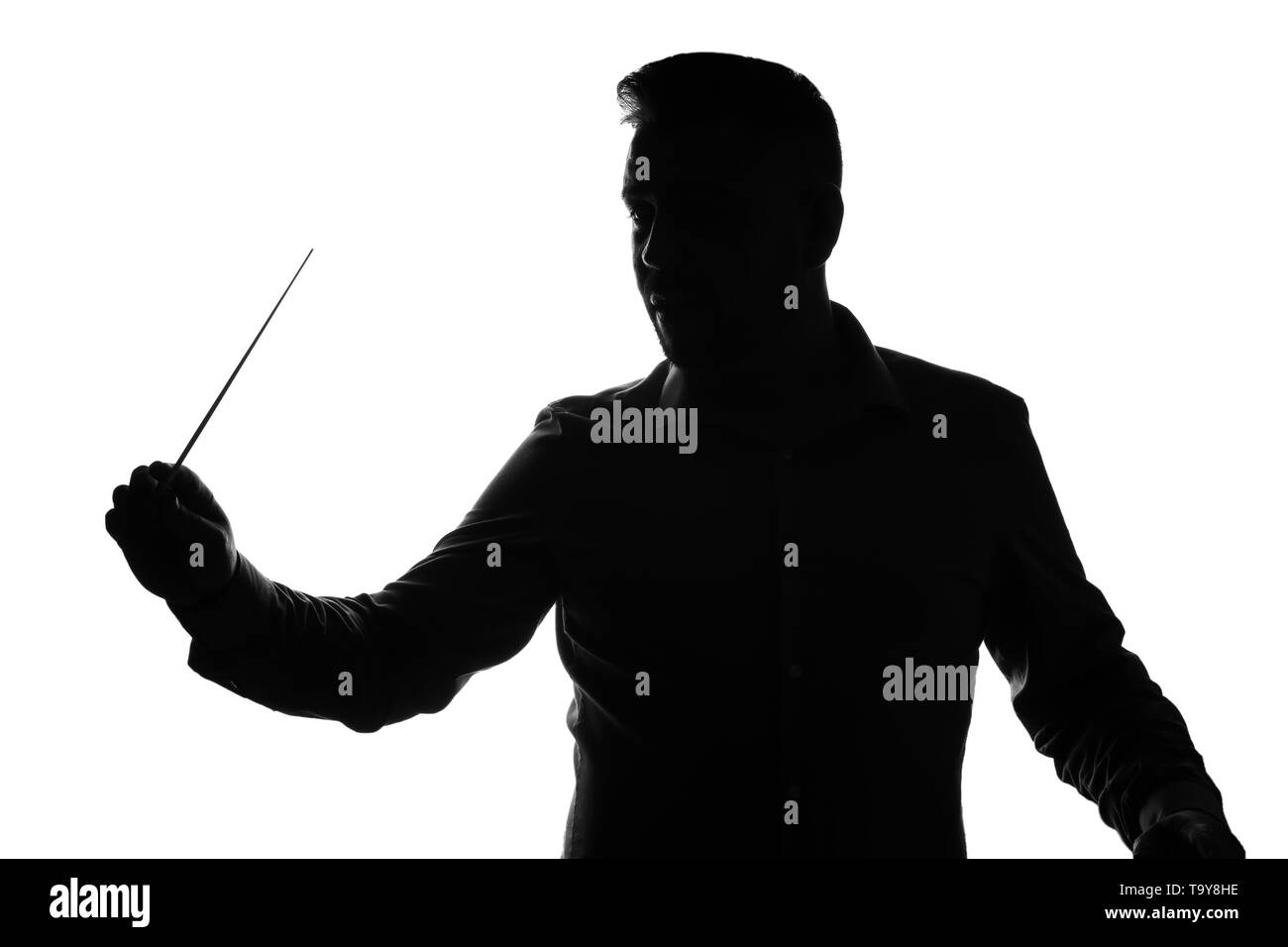 Silhouette of male orchestral conductor on white background Stock Photo