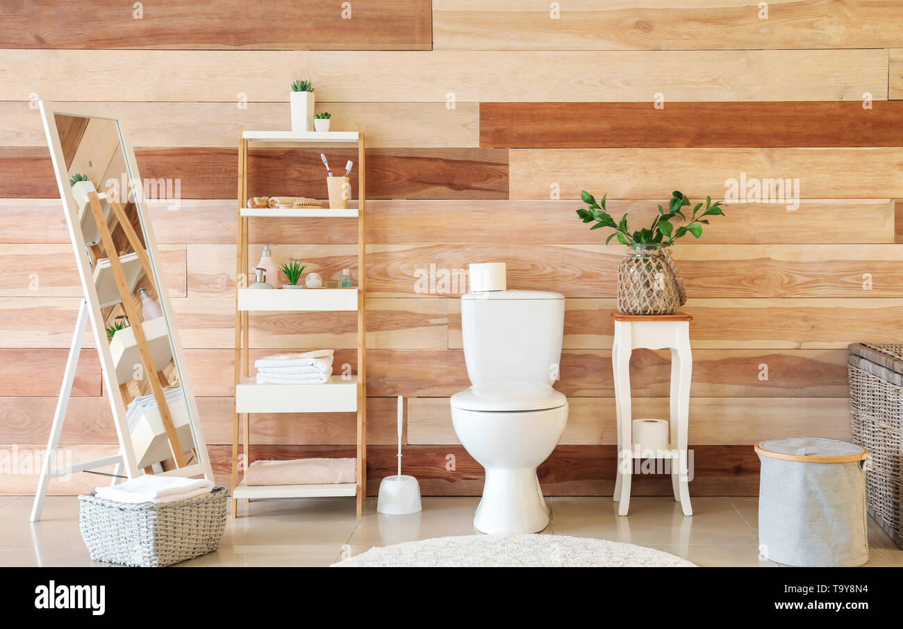 Modern interior of restroom with ceramic toilet bowl Stock Photo - Alamy