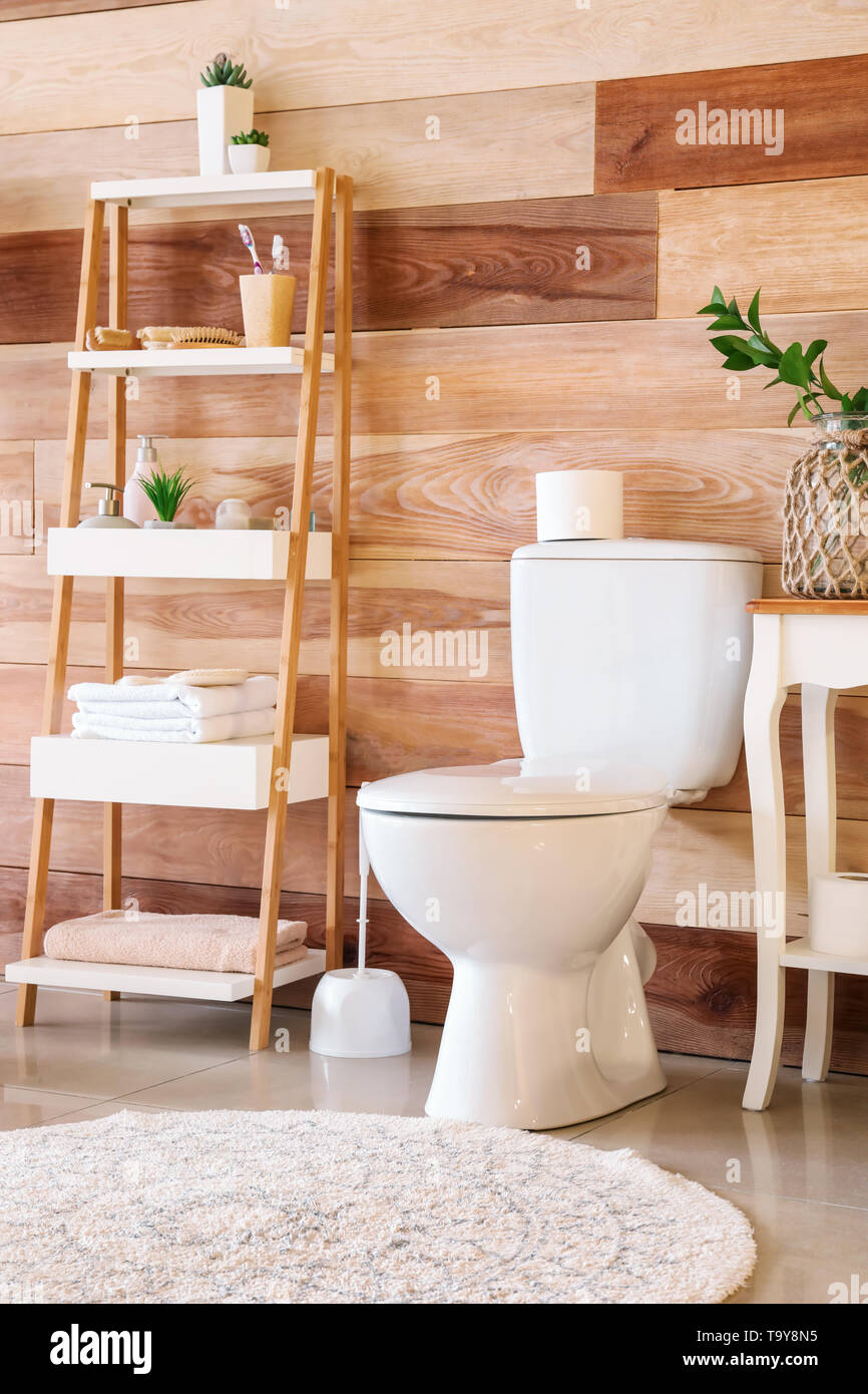 Modern interior of restroom with ceramic toilet bowl Stock Photo - Alamy