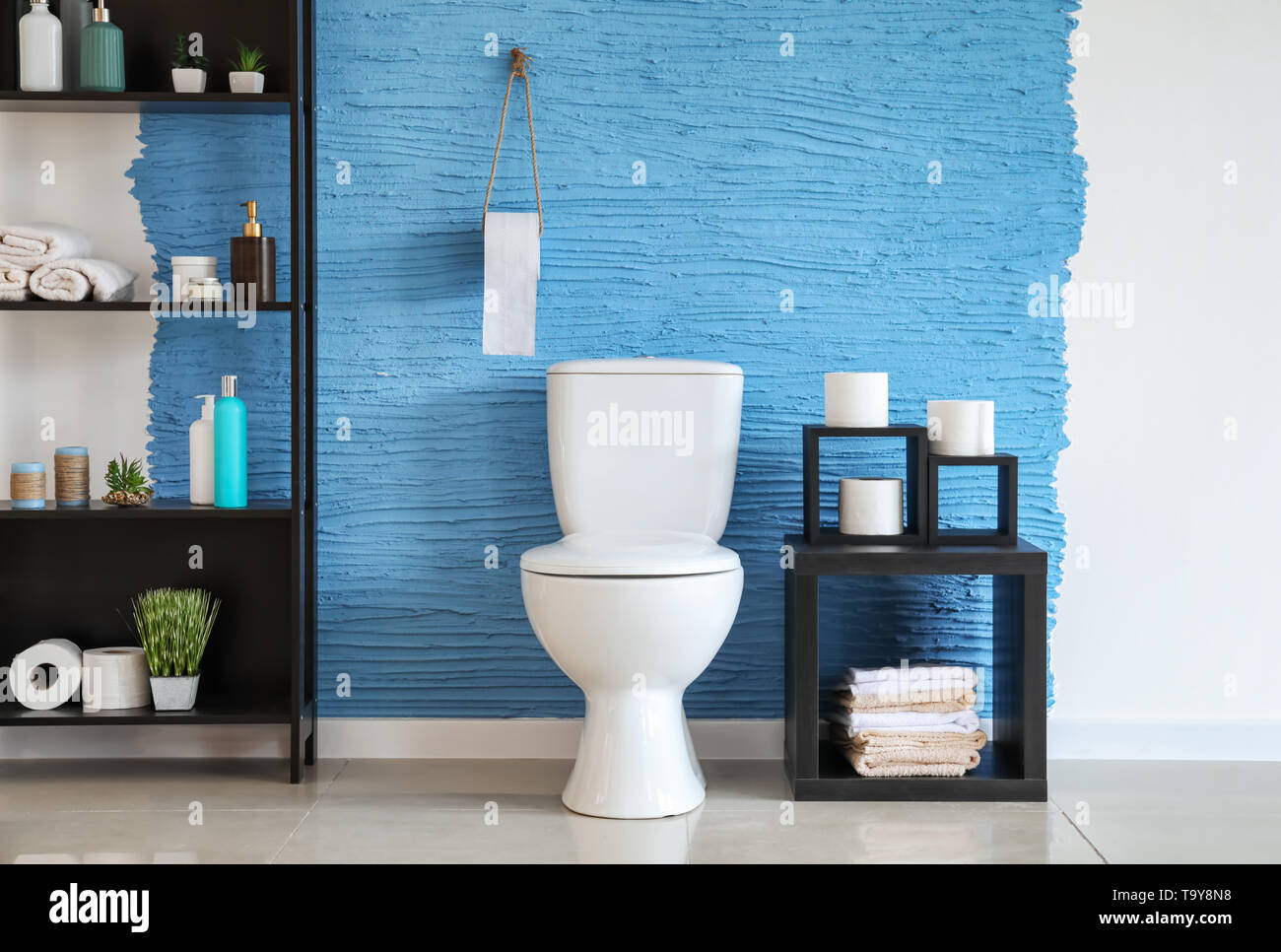 Modern interior of restroom with ceramic toilet bowl Stock Photo - Alamy