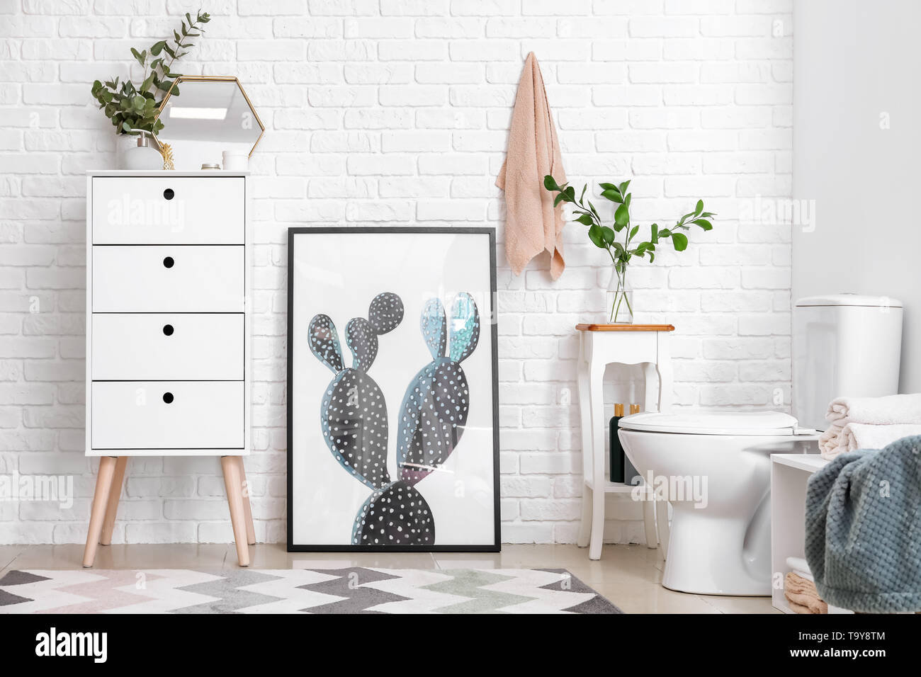 Modern interior of restroom with ceramic toilet bowl Stock Photo - Alamy