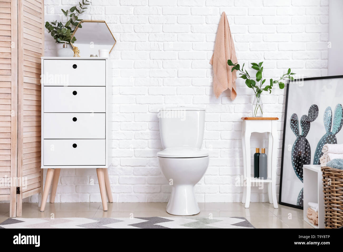 Modern interior of restroom with ceramic toilet bowl Stock Photo - Alamy