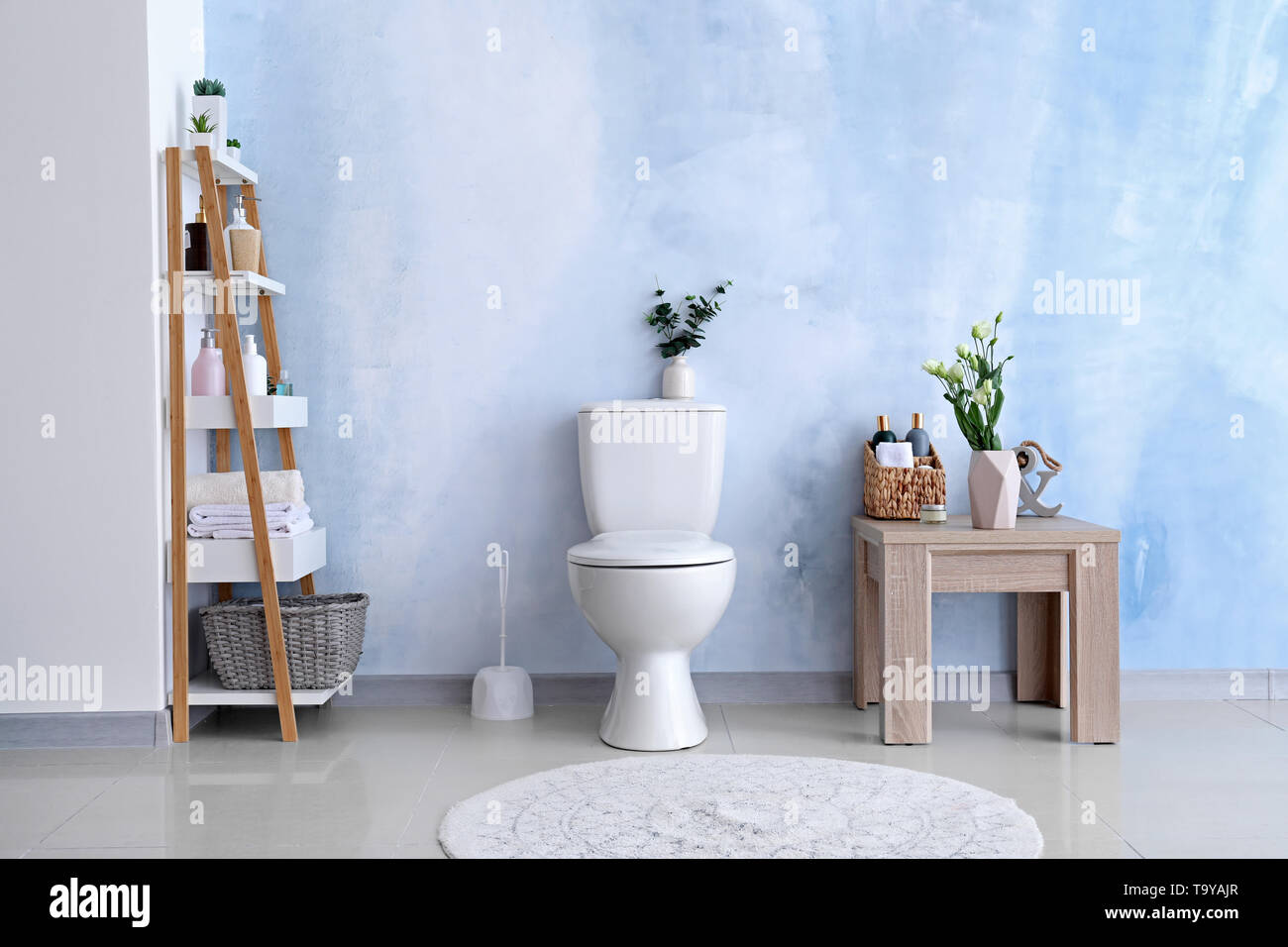 Modern interior of restroom with ceramic toilet bowl Stock Photo - Alamy