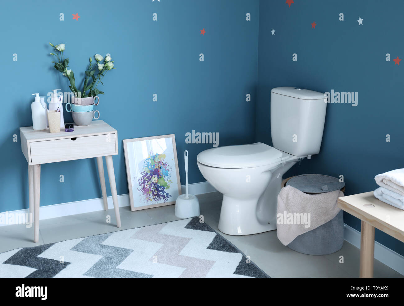 Modern interior of restroom with ceramic toilet bowl Stock Photo - Alamy