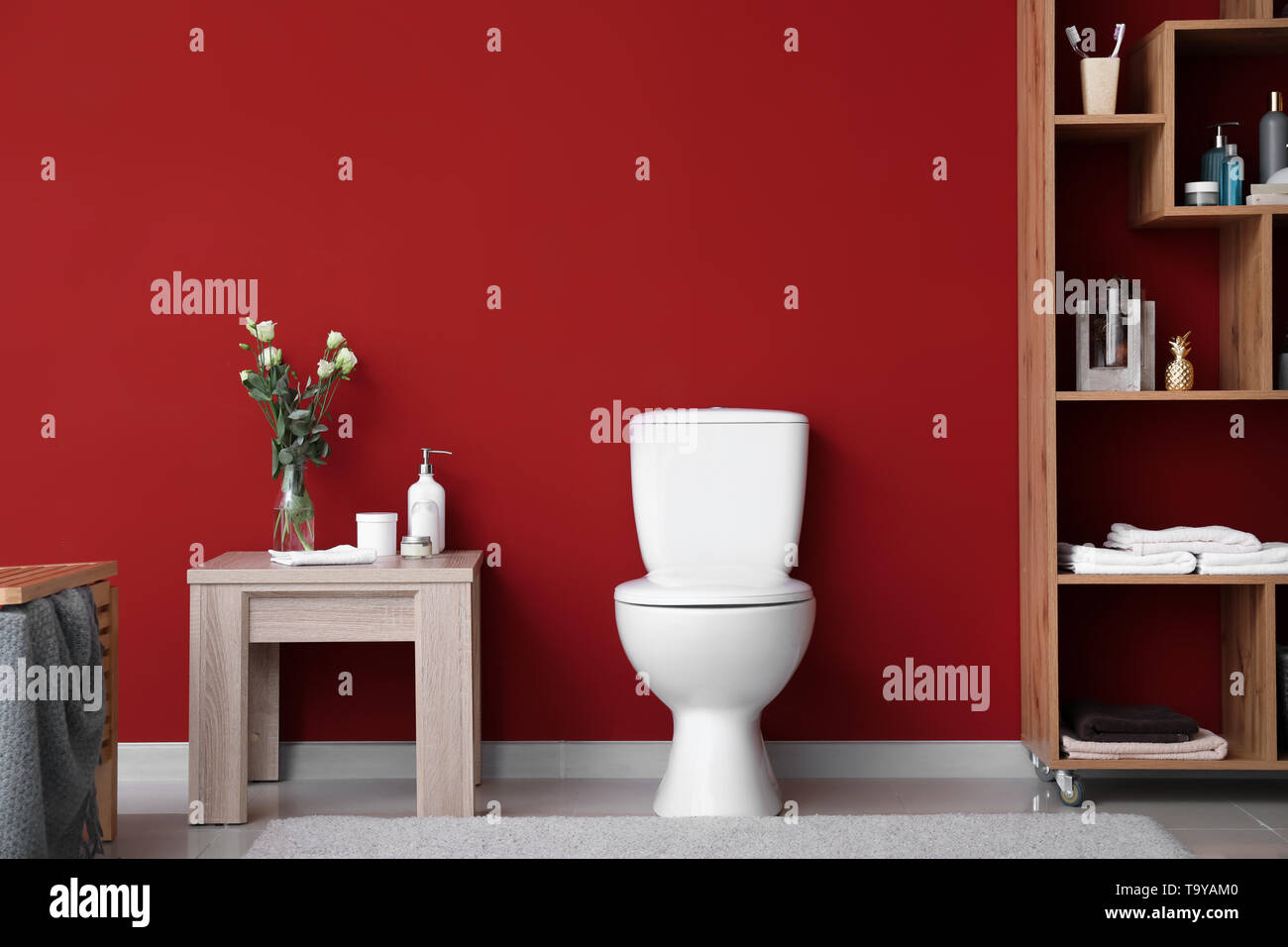 Modern interior of restroom with ceramic toilet bowl Stock Photo - Alamy