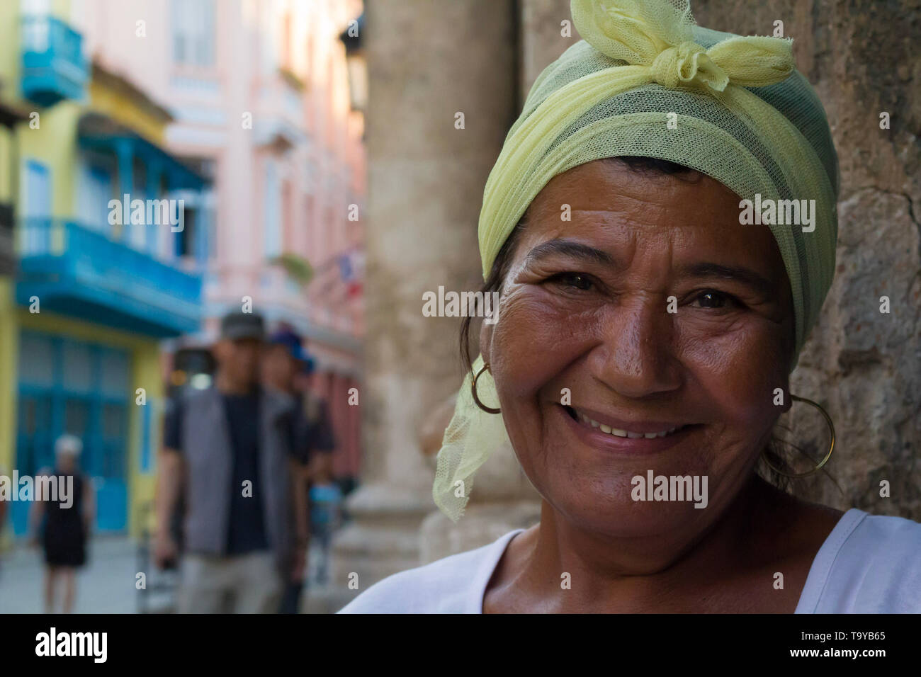 Middle aged Cuban woman who works as a fortune teller reading cards on the street in Havana. Stock Photo