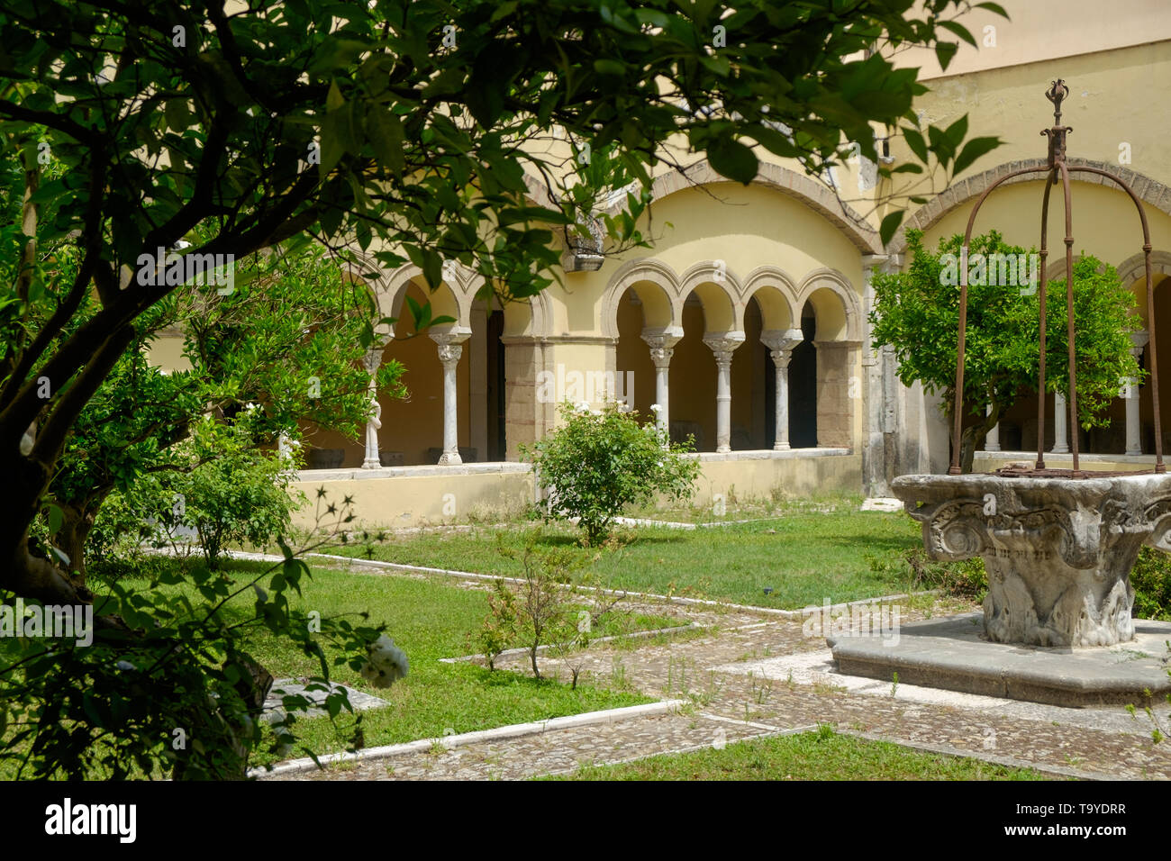 The Santa Sofia cloister in Benevento is a romanesque masterpiece and has a peaceful garden that you can see while visiting the 'Museo del Sannio'. Stock Photo