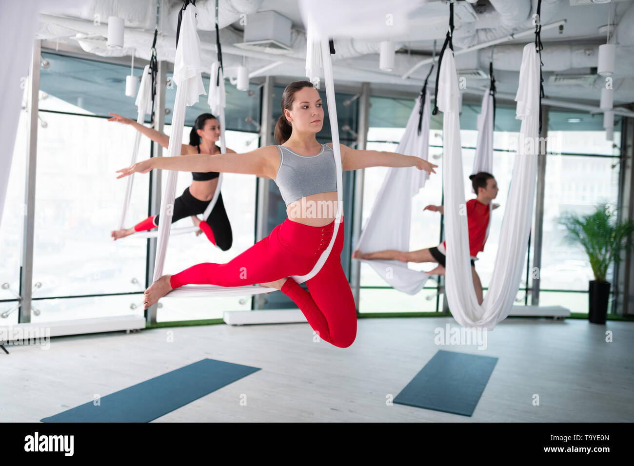 aerial yoga pose Stock Photo 