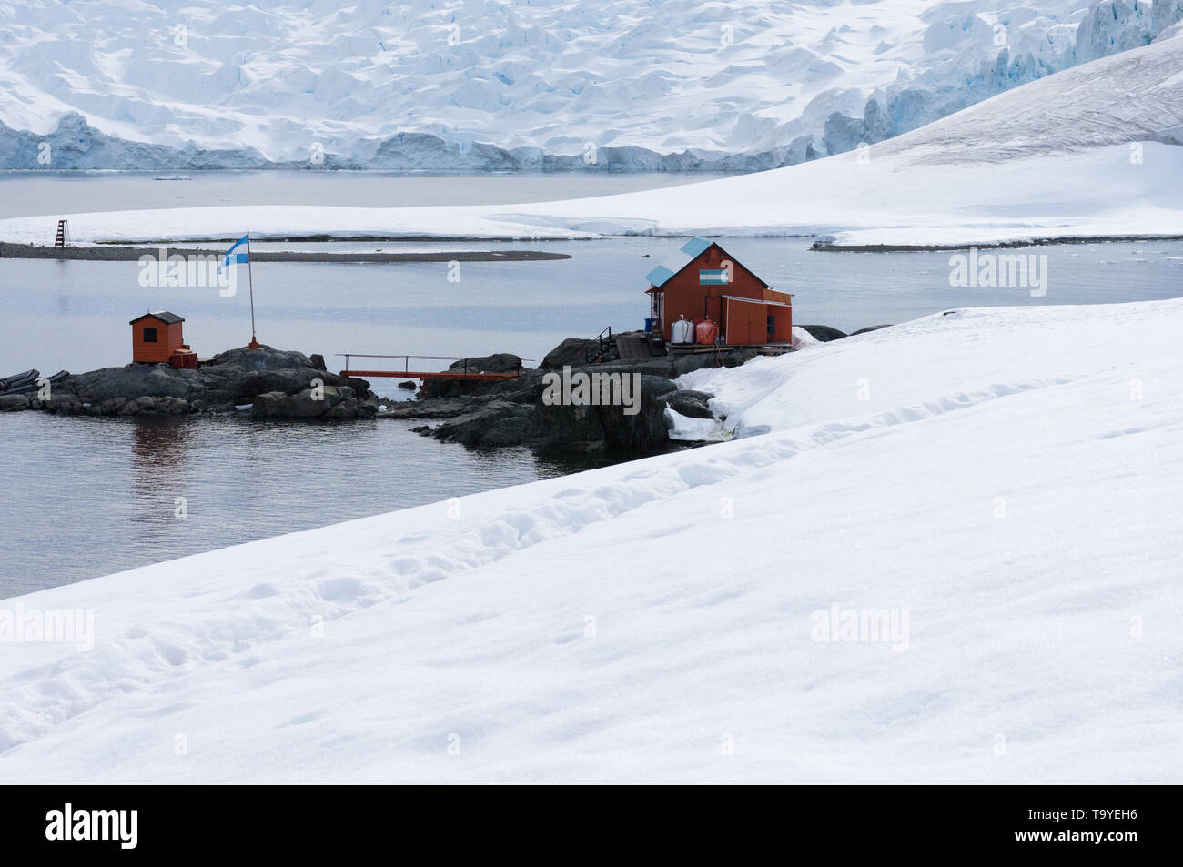 Camp Brown, an Argentinean research base in Antarctica with snow in the foreground and glaciers and water in the background. Stock Photo