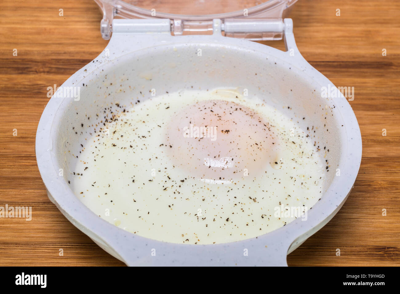 microwave poached egg with pepper Stock Photo Alamy