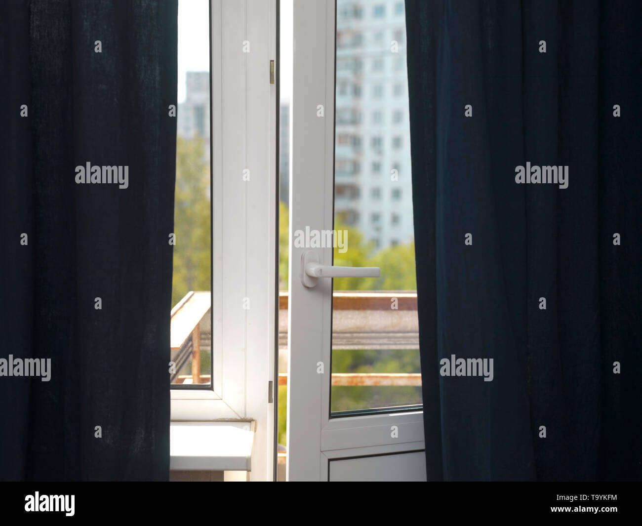 A little fresh air through an open balcony door, interior shot Stock