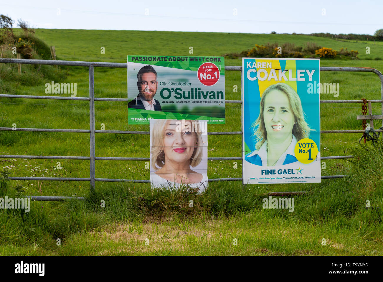 political party posters tied to a farm gate during an election Stock Photo