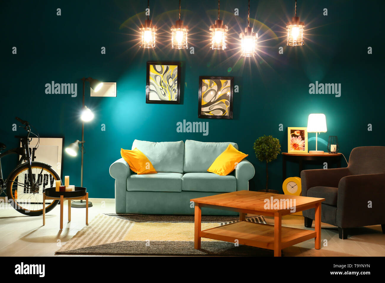 Stylish interior of living room with comfortable sofa Stock Photo - Alamy