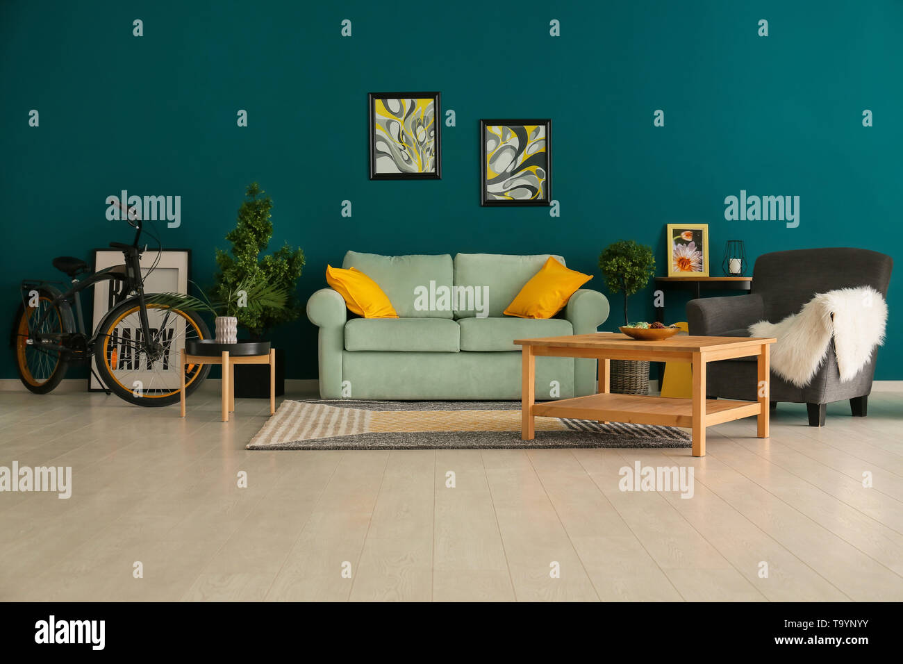 Stylish interior of living room with comfortable sofa Stock Photo - Alamy