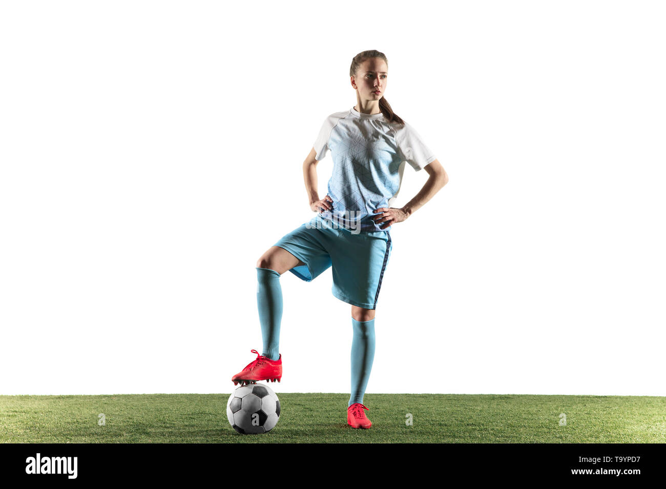 Young Female Football Or Soccer Player With Long Hair In Sportwear