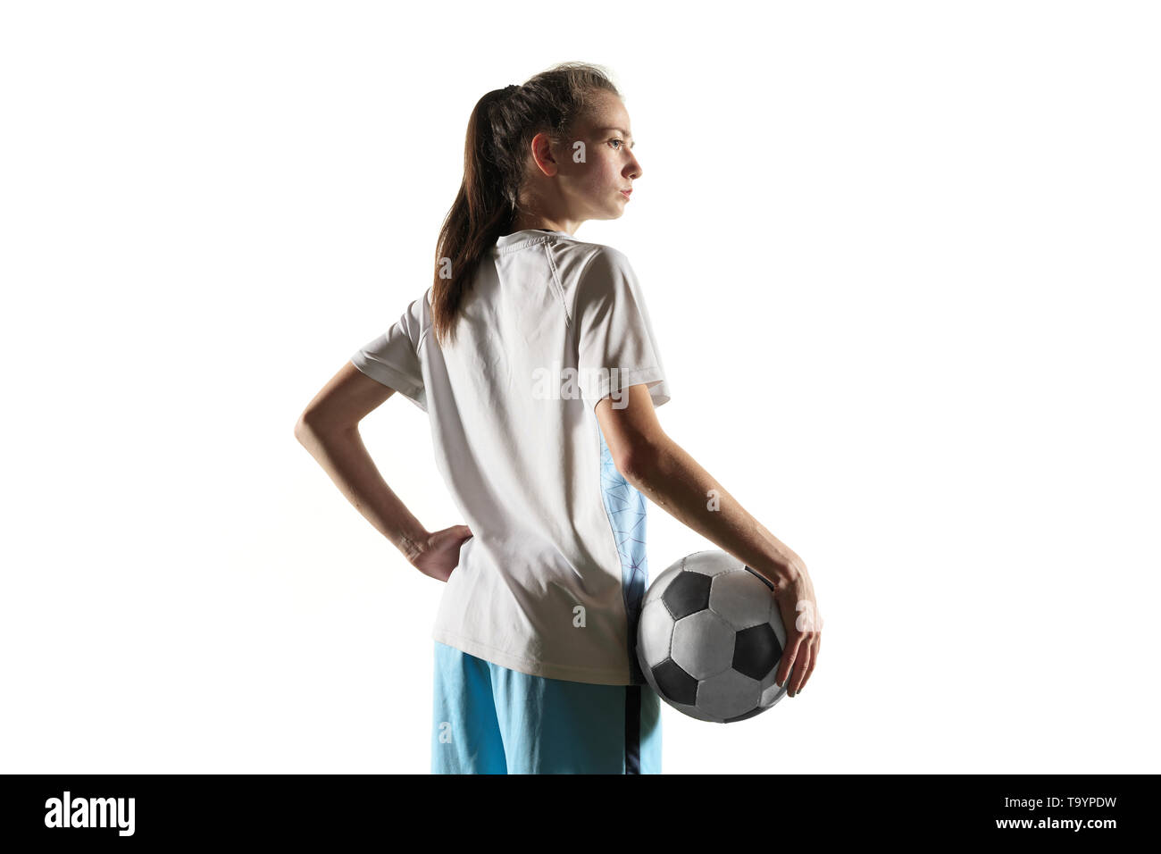 Young Female Football Or Soccer Player With Long Hair In Sportwear