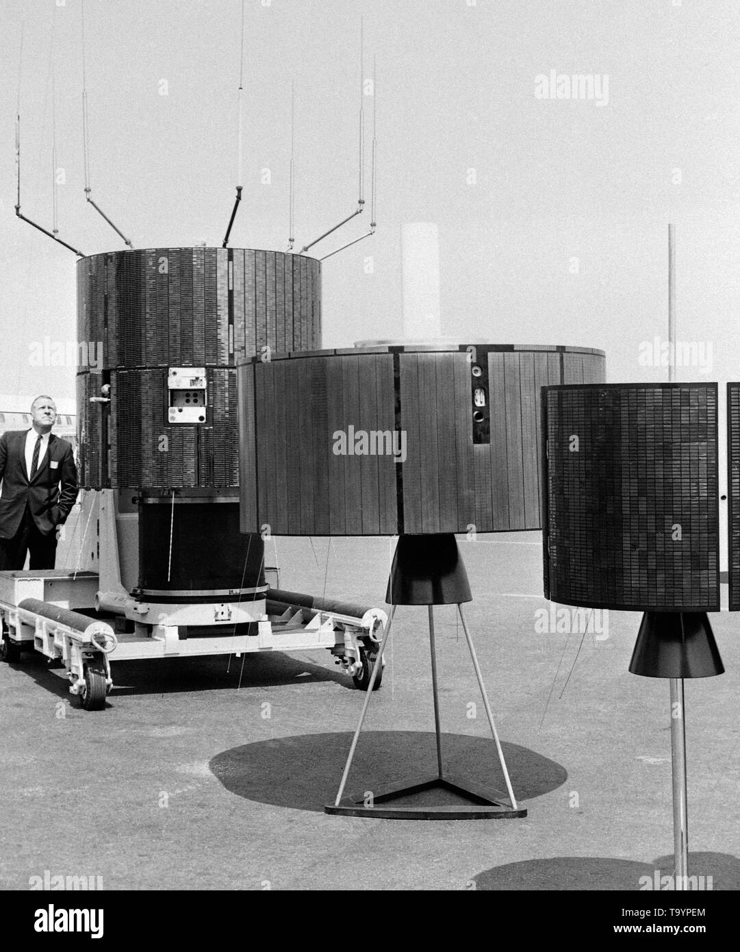 Shown here are replicas for the three satellites that are being used to bring live pictures and commentary from the Mexico Olympics to television audiences in Europe and Japan. The satellites are pictured at Hughes Aircraft Company, Culver City, California, where they were built for the National Aeronautics and Space Administration (NASA) and the Communications Satellite Corporation (Comsat). On left is NASA's Applications Technology Satellite (ATS-3) which, over the east coast of Brazil, is transmitting the picture to Europe while voice commentary of the European telecast in a dozen languages Stock Photo