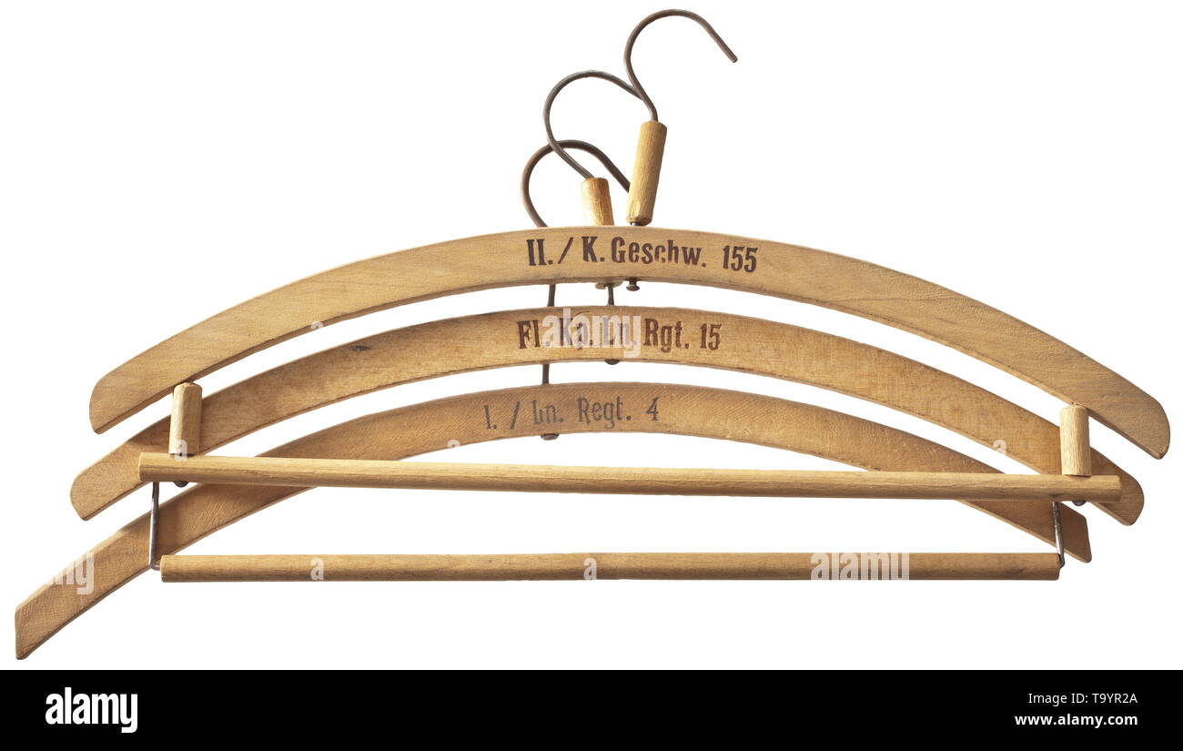 Three clothes hangers from Luftwaffe barracks Jeweils Holz mit Truppenstempelung 'Fl.Kp.Ln.Rgt. 15', 'II./K.Geschw. 155' und 'I./Ln. Regt. 4'. historic, historical, Air Force, branch of service, branches of service, armed service, armed services, military, militaria, air forces, object, objects, stills, clipping, clippings, cut out, cut-out, cut-outs, 20th century, Editorial-Use-Only Stock Photo