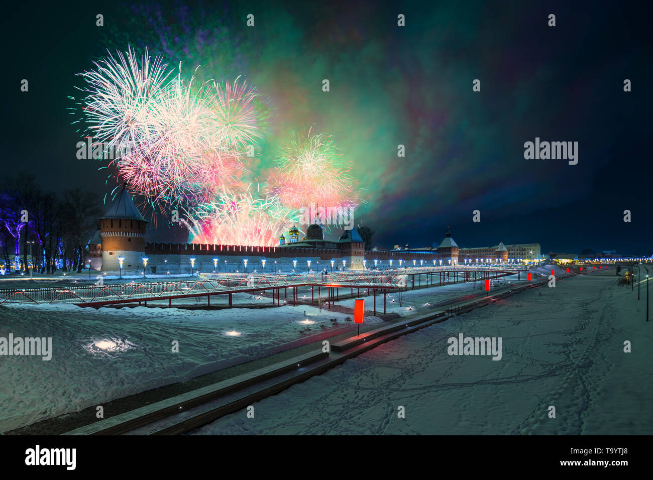 Winter night fireworks over kremlin and Upa quay in Tula, Russia at