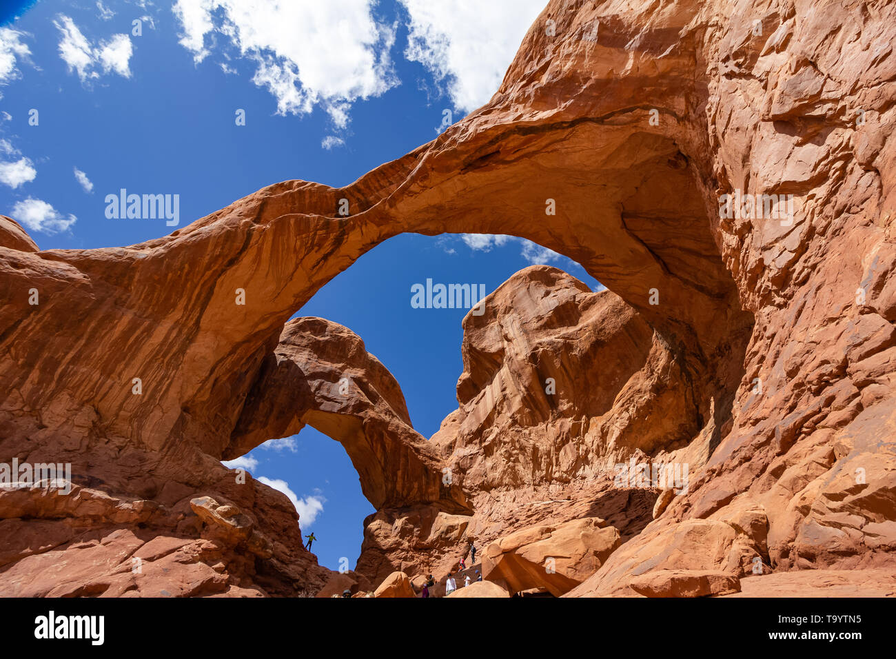 arch of rock with blue sky in the background Stock Photo