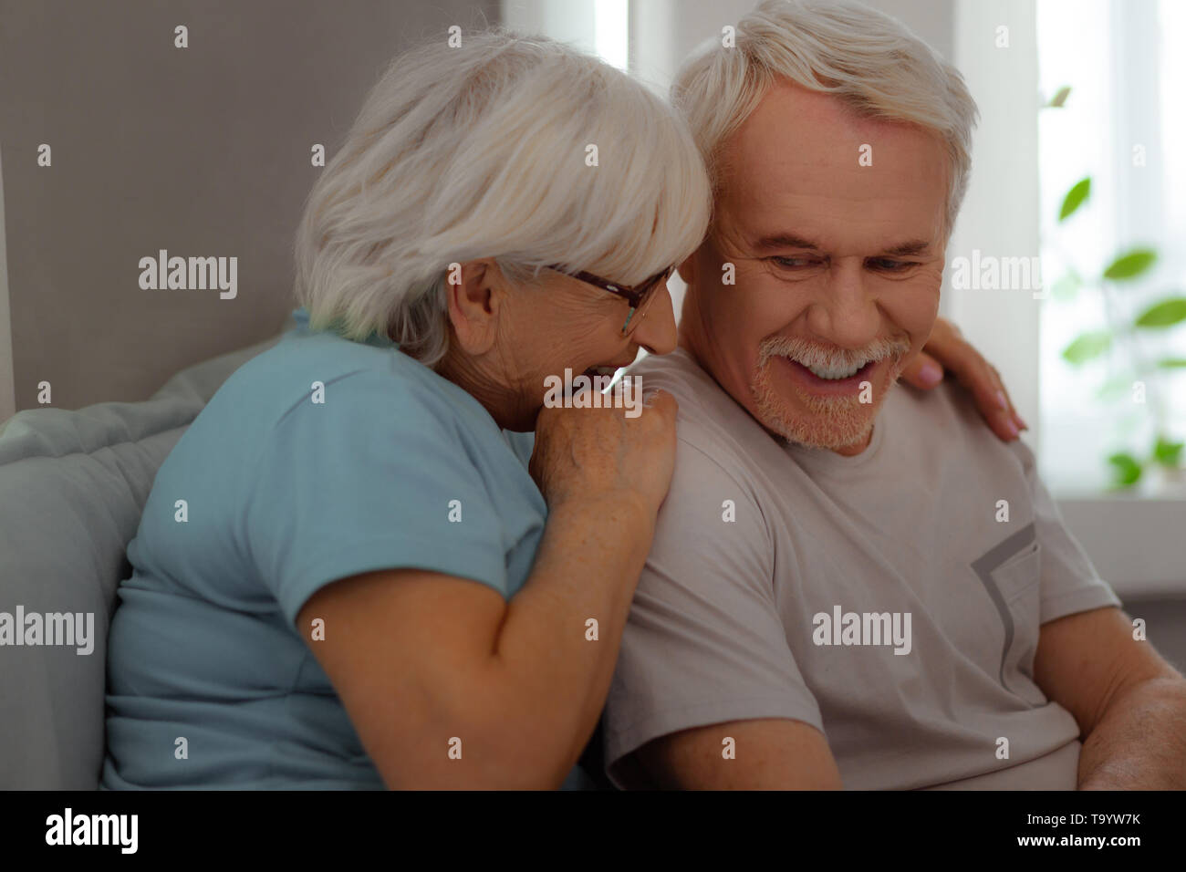 Old couple embracing in bed hi-res stock photography and images - Alamy