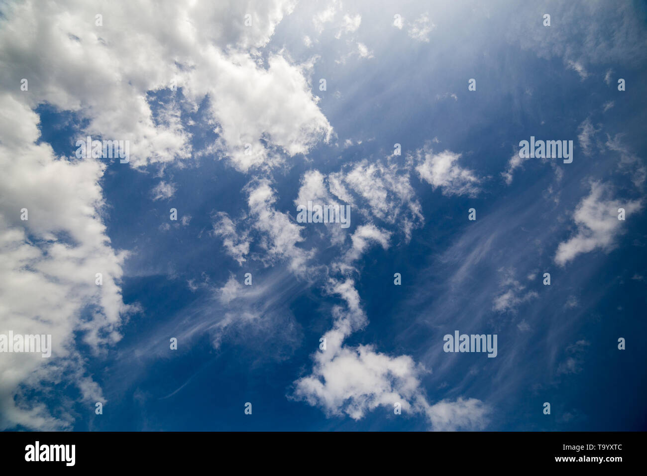 mixed zenith clouds at noon daylight wide angle shot. Stock Photo