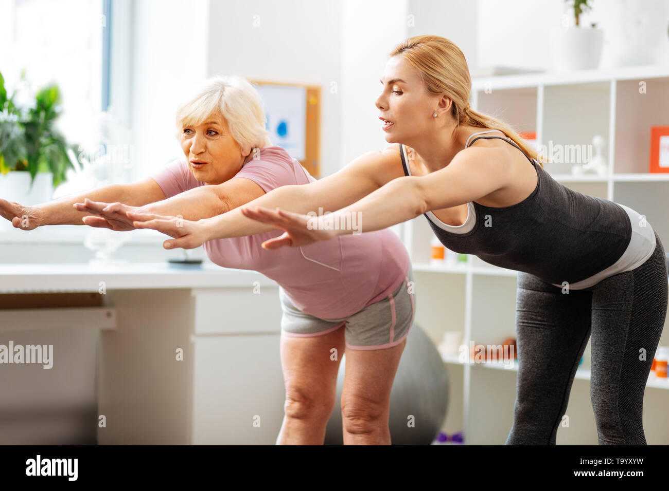 Nice fit woman training with a patient Stock Photo