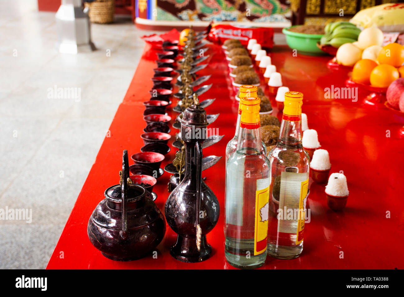 Sacrificial offerings and rice whisky alcohol for chinese people pray god and memorial to ancestor in Tiantan temple at Shantou or Swatow on May 7, 20 Stock Photo