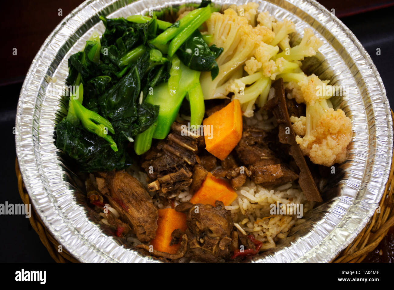 Chinese food rice topping with boil duck sweet brown sauce with fired boiled vegetable in local restaurant at Shantou town or Swatow city on May 8, 20 Stock Photo
