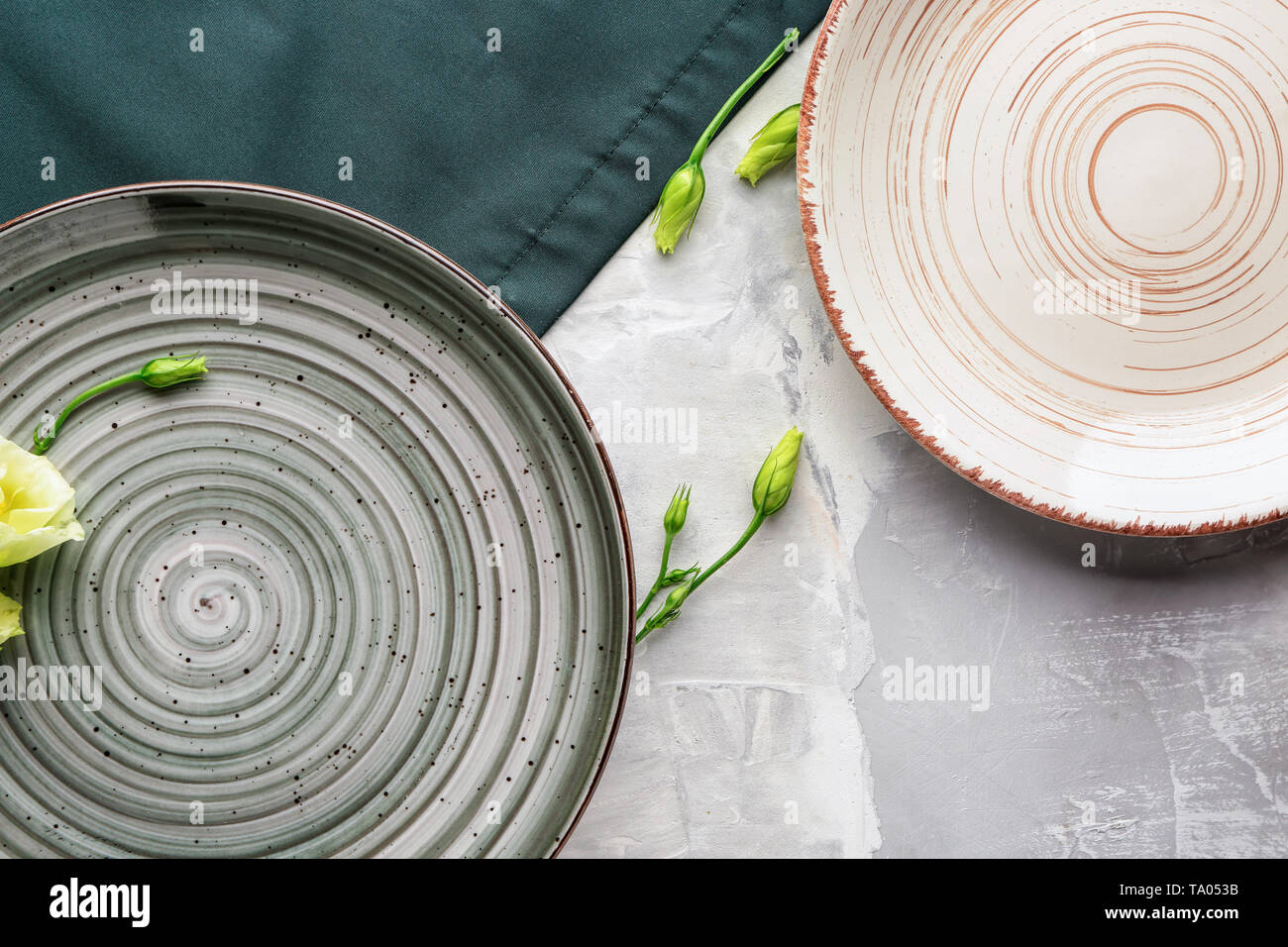 Stylish plates on grey background Stock Photo
