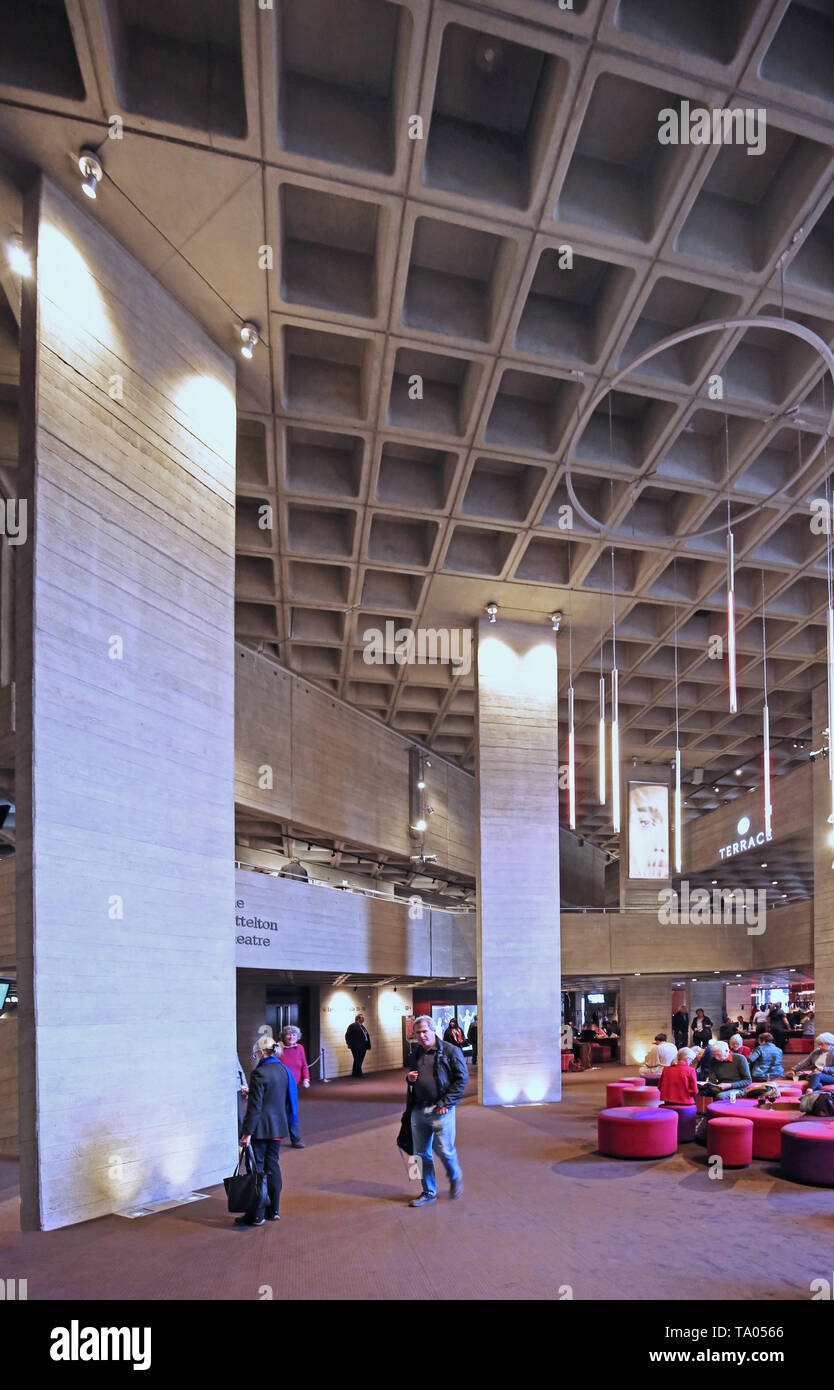 Public foyer of London's National Theatre on the south bank of the River Thames. Famous brutalist building designed by Denys Lasdun. Opened in 1976. Stock Photo