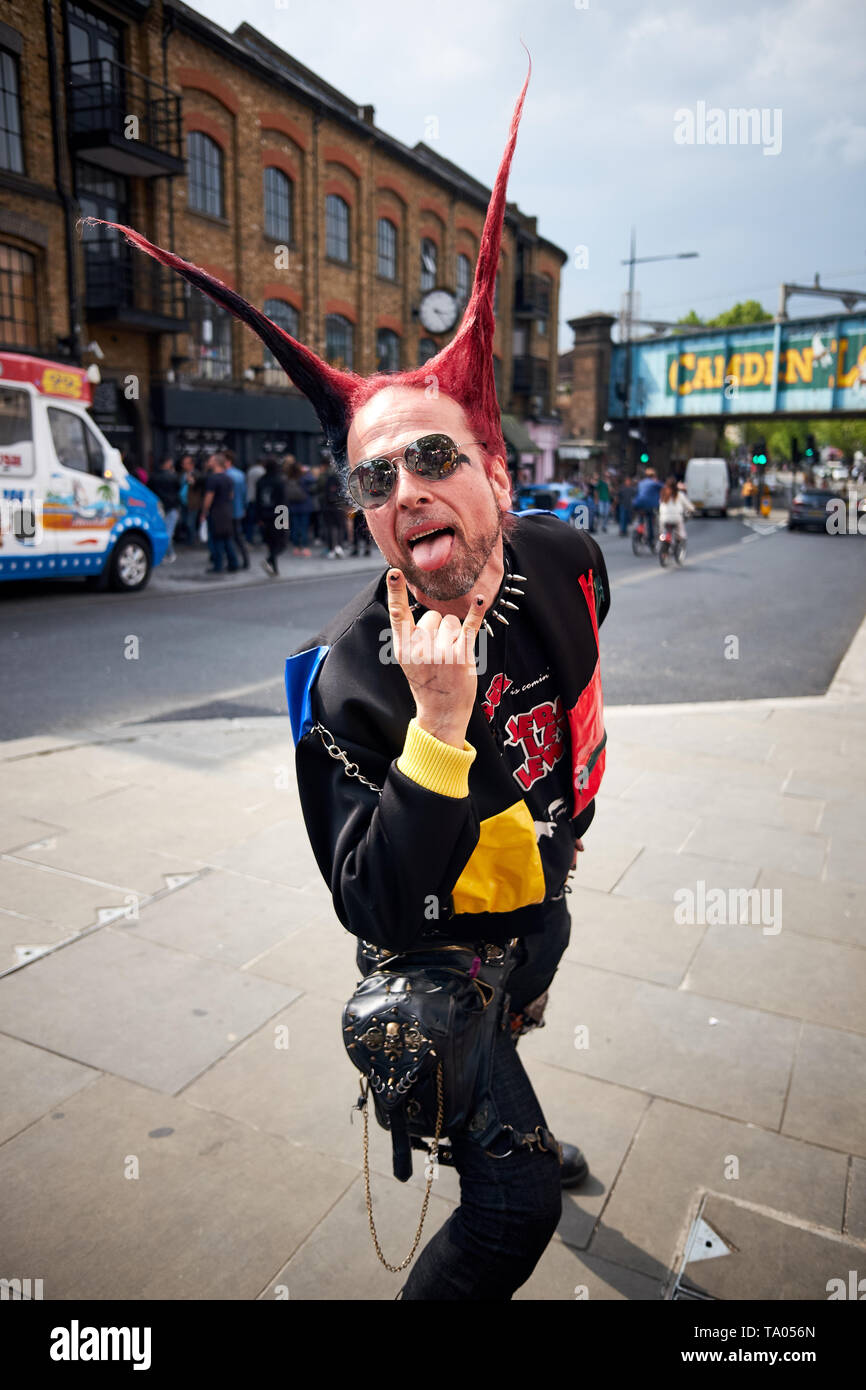 London / UK - May 18th 2019: A man dressed in punk clothing and with spiked hair poses for camera on Camden High Street, Camden Town, London. Stock Photo
