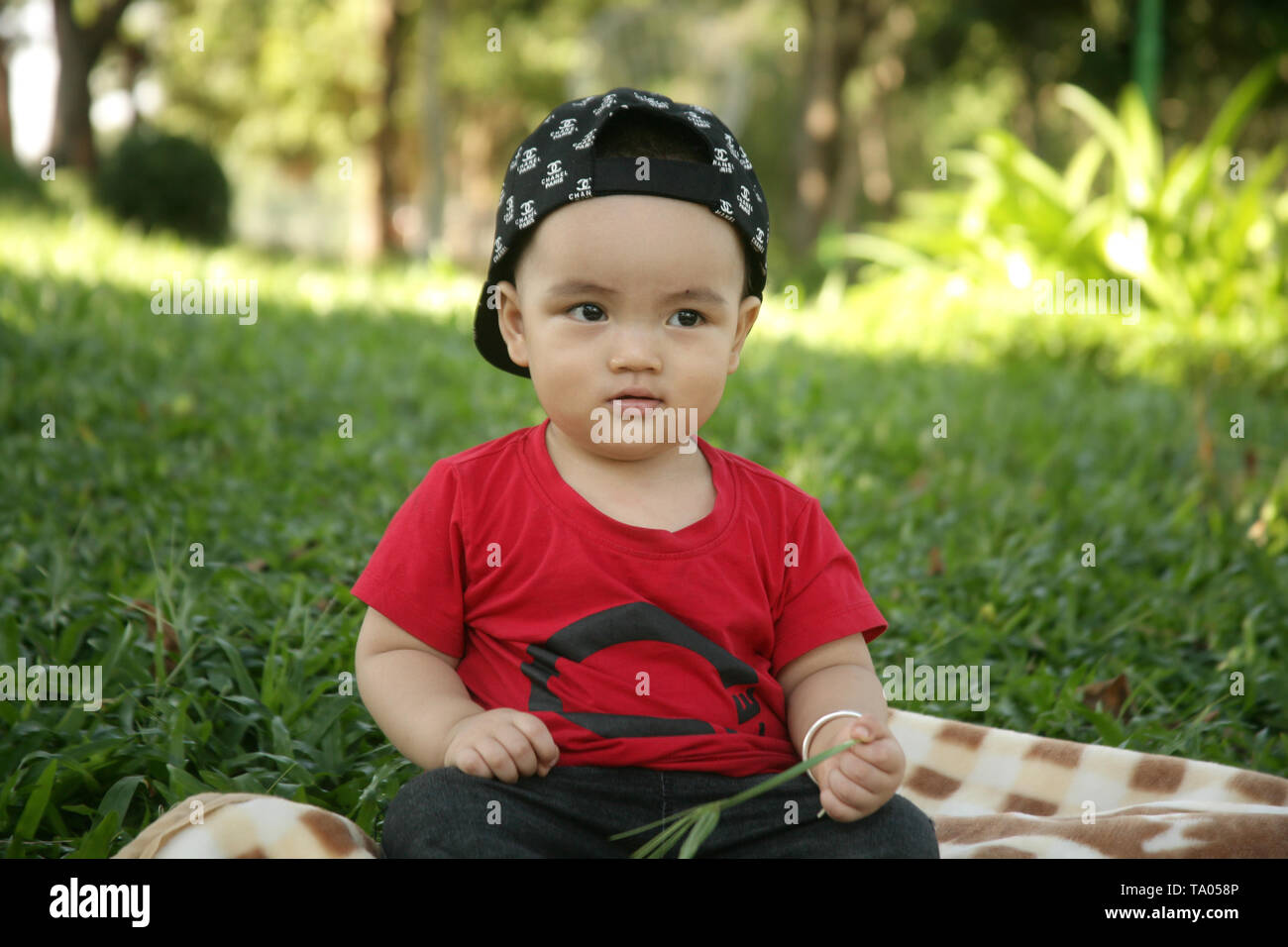 Cute baby boy photo wearing red shirt Stock Photo - Alamy