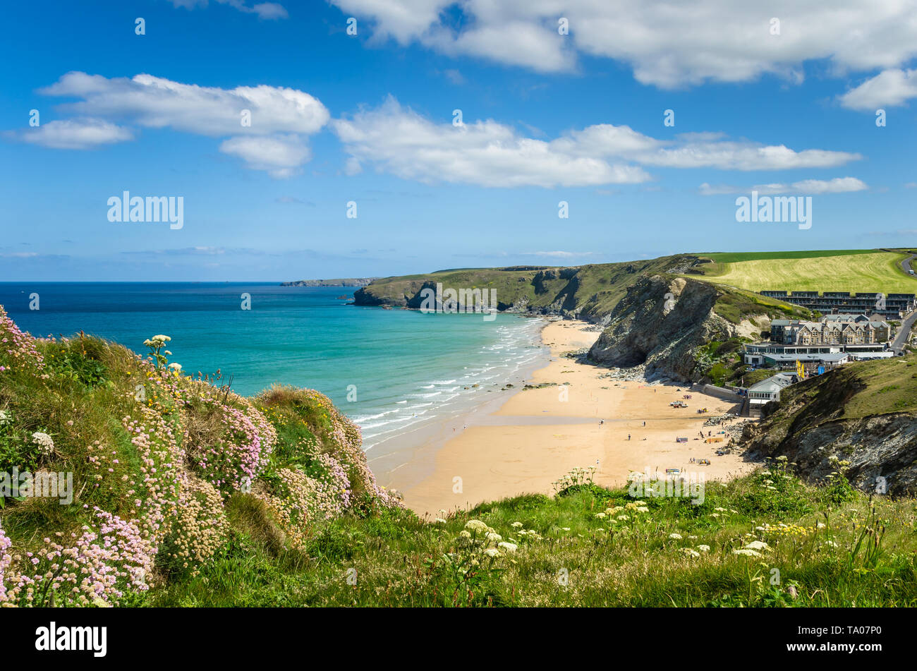 Beautiful sandy beach along the rugged coast of Cornwall on a clear spring day Stock Photo