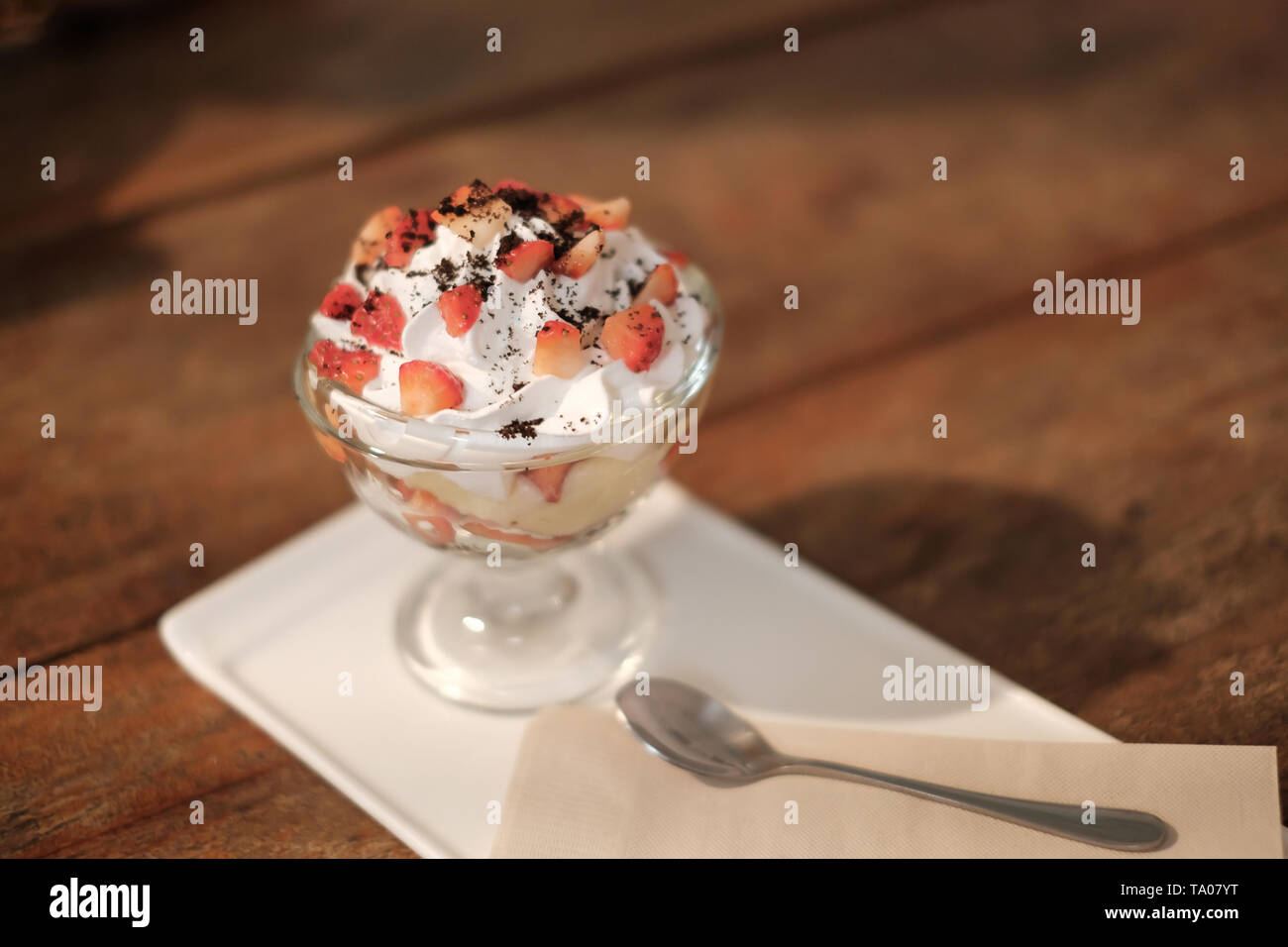 Strawberry topping on icecream vanilla Stock Photo Alamy